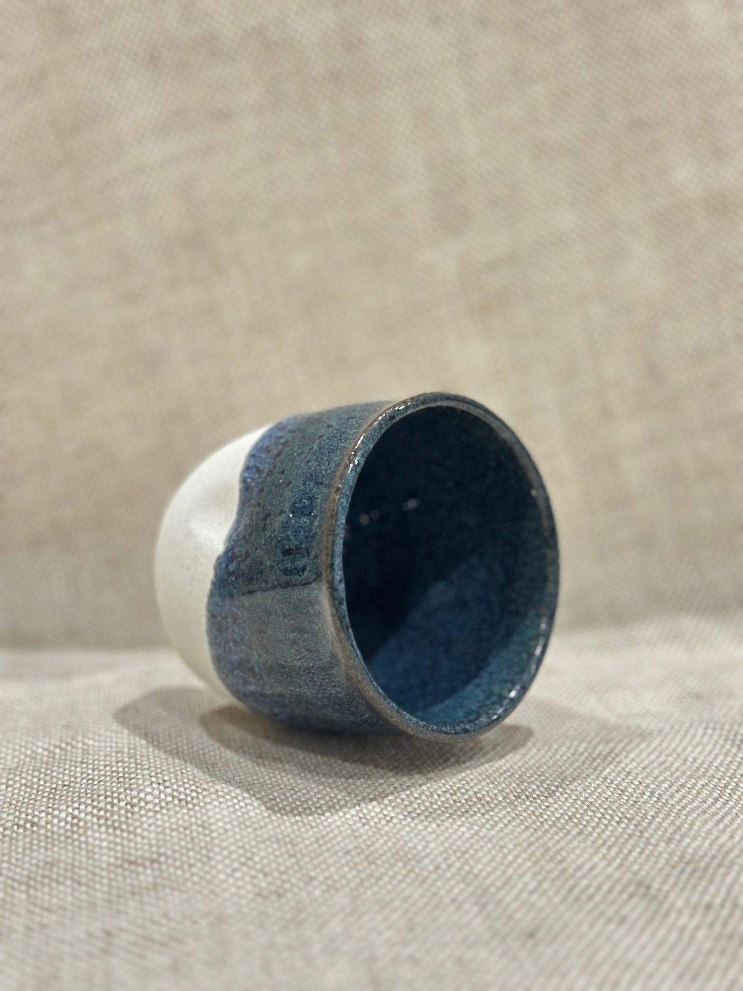 Dimple cup in blue/white glaze