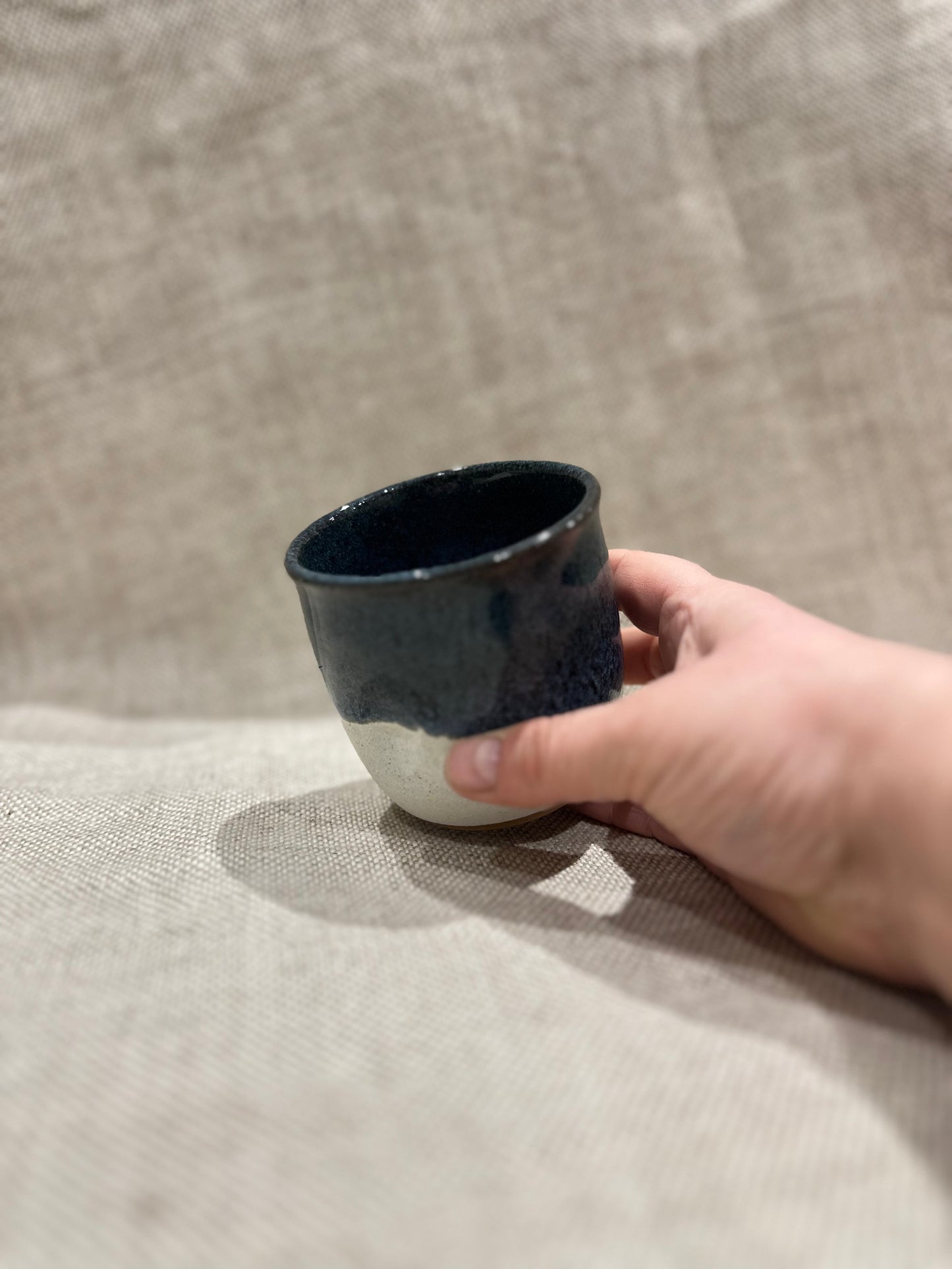 Dimple cup in blue/white glaze
