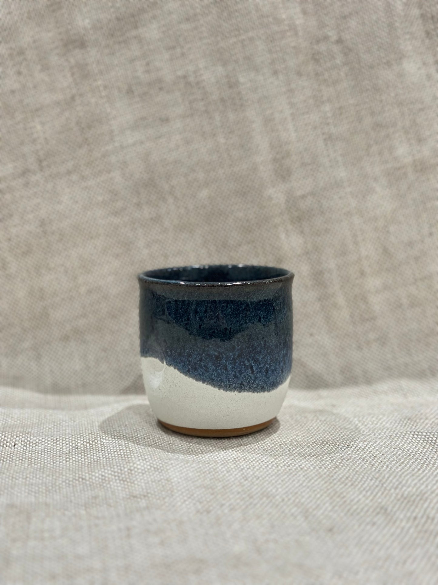 Dimple cup in blue/white glaze